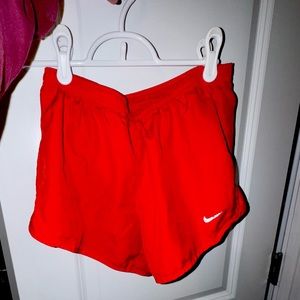 Vibrant red Nike shorts! Size xs! One minor snag, but only wore a few times